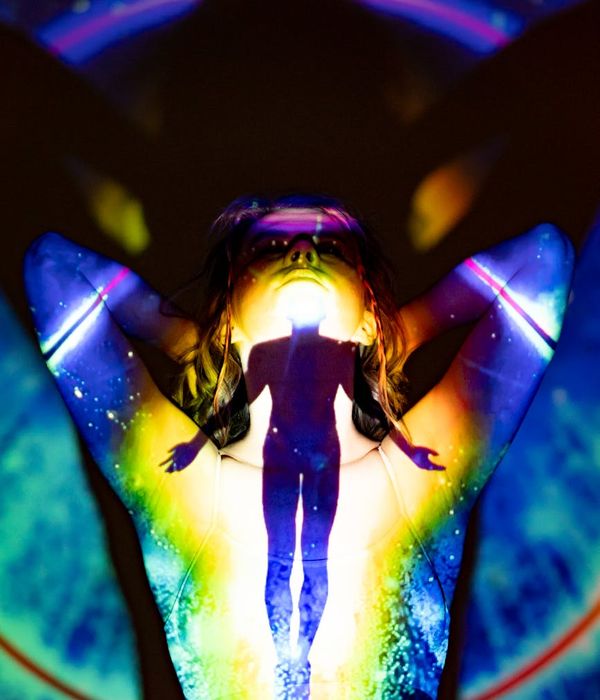 Woman in a dynamic yoga pose symbolizing energy and flow.